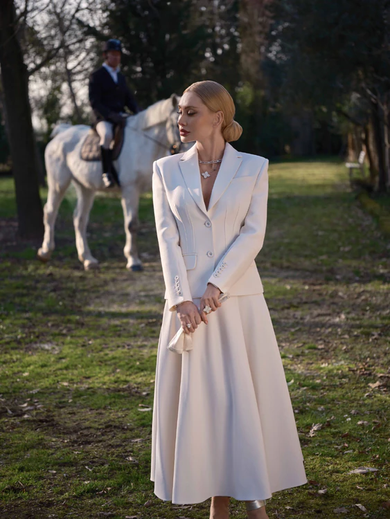 Suit with a full skirt