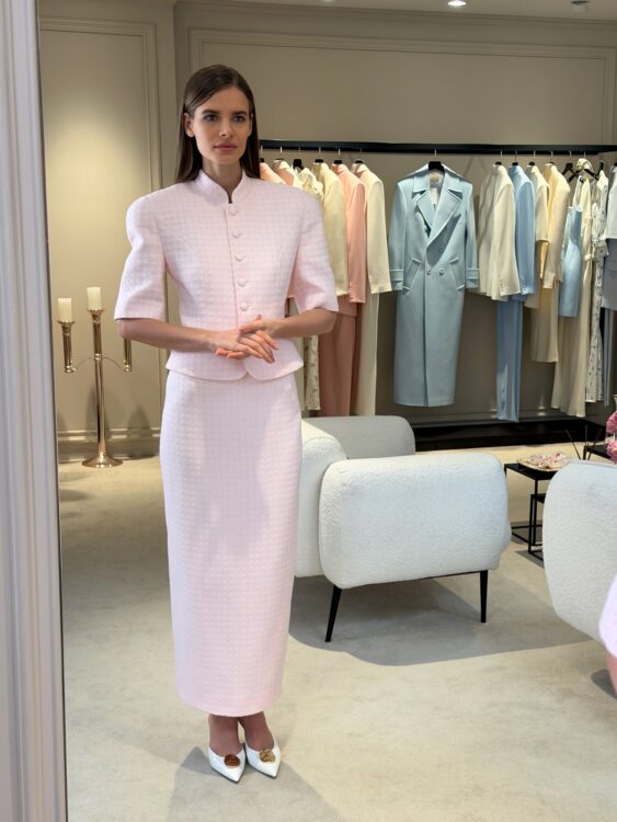 Tweed suit in a soft pink color with a maxi skirt